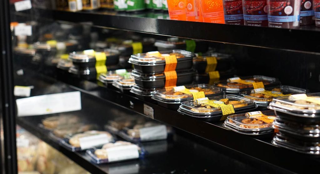 Refrigerator case displaying pre-made meals, available in the Husky Union Den marketplace