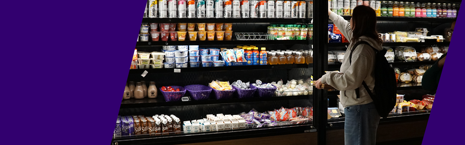 UW student shopping take-away food options at the HUB market