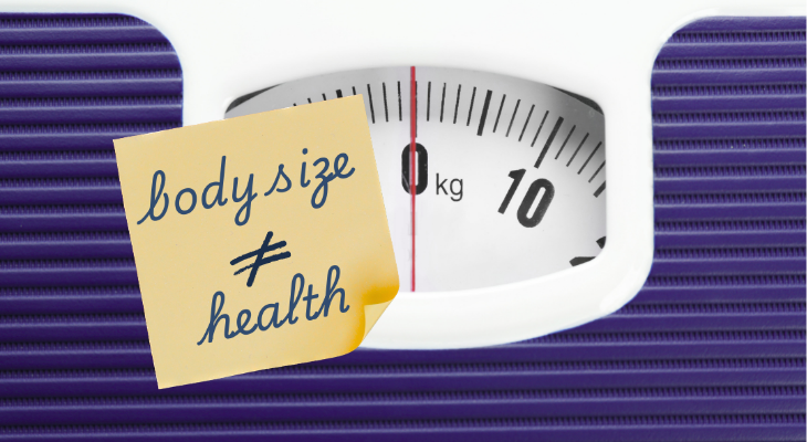 Body size does not equal health concept graphic of scale with post-it note
