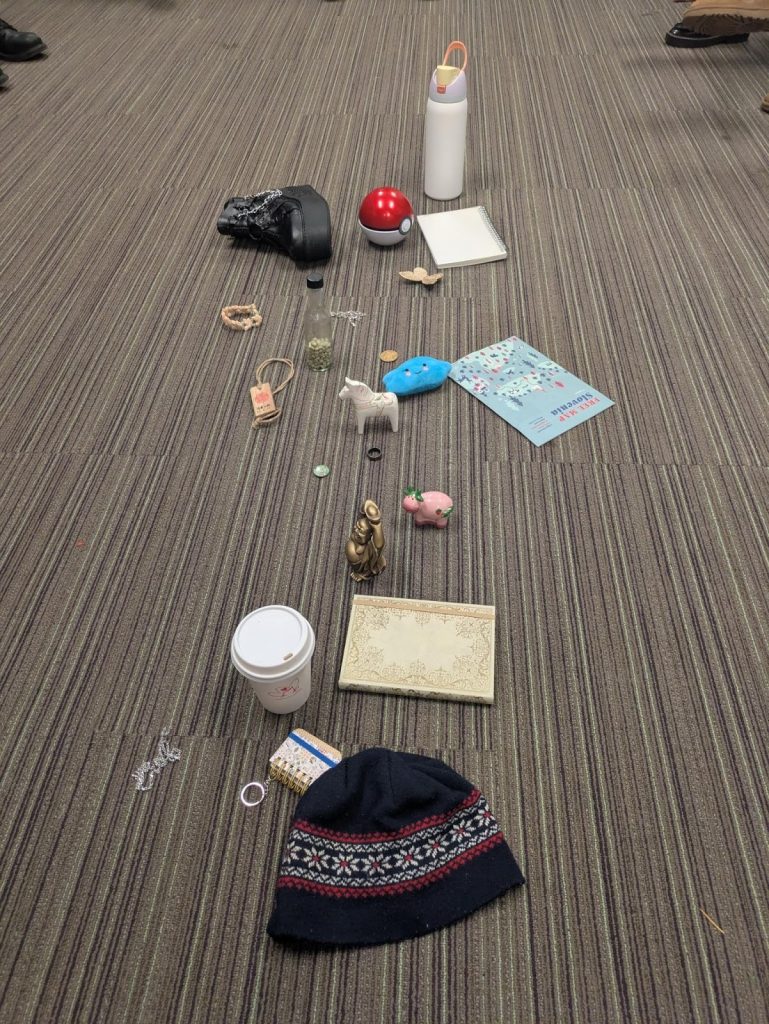 Personal artifacts contributed by students laid out on floor