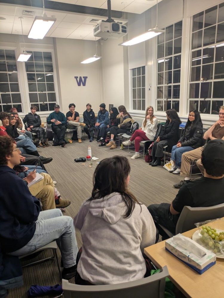 Student members of the Food Systems Leadership Coalition of UW at their inaugural meeting in November 2025. Students sit in a circle